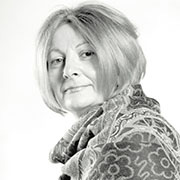 Black and white headshot of an older atractive woman.